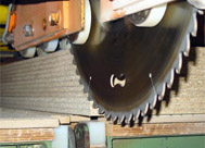 Cutting stacked panels with a diamond saw blade